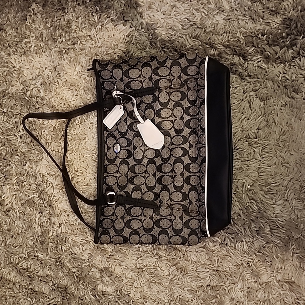 Coach Peyton Perforated PVC Signature Top Zip Tote. Black and white.